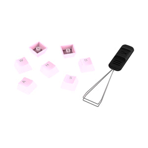 HyperX PBT Keycaps in Pink scattered with keycap removal tool