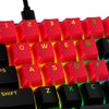closeup view of HyperX rubber keycaps in red with lit keyboard